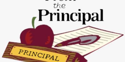 image of clipart of principals desk with an apple, pen, piece of paper and principal name tag with text from the principal. Used to link to messages from the principal.
