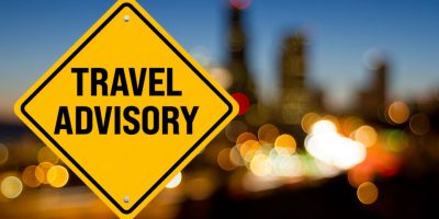 image of yellow sign with words travel advisory. This links to a March 26, 20201 travel advisory from the NYC DOE